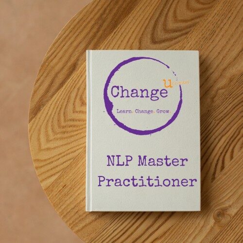White note book on wooden table - NLP Master Practitioner Course